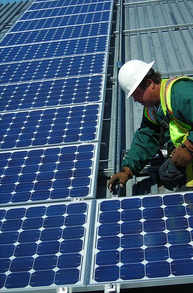 Man installing solar panles